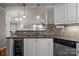Open kitchen view featuring granite counters, stainless appliances, and lake views at 1033 Southwest Dr, Davidson, NC 28036