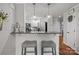 Bright, airy kitchen with bar seating, stainless appliances, granite counters and hardwood floors at 1033 Southwest Dr, Davidson, NC 28036