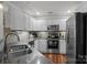 Spacious kitchen with stainless appliances, granite countertops, and ample storage at 1033 Southwest Dr, Davidson, NC 28036