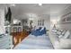 Bright open-concept living space with hardwood floors, dining area, and bar seating at 1033 Southwest Dr, Davidson, NC 28036