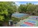 Aerial view of well-maintained community pickleball courts surrounded by lush green trees at 1033 Southwest Dr, Davidson, NC 28036