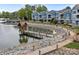 Picturesque waterfront community with lush landscaping, dock, and walking path, offering scenic lake views at 1033 Southwest Dr, Davidson, NC 28036