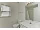 Clean, well-lit bathroom with a window, toilet, sink, vanity, mirror, and shower at 1037 Hammond Dr, Matthews, NC 28104