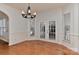 Bright dining room featuring hardwood floors, wainscoting, and french doors at 1037 Hammond Dr, Matthews, NC 28104