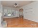 Bright living room boasts hardwood floors, large windows, and a cozy fireplace at 1037 Hammond Dr, Matthews, NC 28104