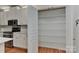 Walk-in pantry featuring ample shelving, conveniently located adjacent to the kitchen with extra storage at 1037 Hammond Dr, Matthews, NC 28104
