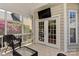 Charming screened porch with outdoor seating and view of the backyard at 1037 Hammond Dr, Matthews, NC 28104