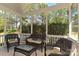 Cozy screened porch furnished with wicker seating and scenic views at 1037 Hammond Dr, Matthews, NC 28104