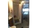 Functional bathroom with a shower, sink, and a view into the bedroom at 108 Captains Ct # B116, Mount Gilead, NC 27306