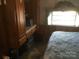 Bedroom with built-in storage and a view to the window at 108 Captains Ct # B116, Mount Gilead, NC 27306