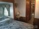 Bedroom with a bed, side table, and an open closet at 108 Captains Ct # B116, Mount Gilead, NC 27306