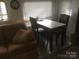 Bright dining area with a table and chairs, perfect for enjoying meals at 108 Captains Ct # B116, Mount Gilead, NC 27306