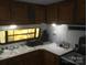 Kitchen showcasing sink, cooking appliances and cabinets at 108 Captains Ct # B116, Mount Gilead, NC 27306