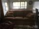 Comfortable living room with a plush sofa, perfect for relaxing and entertaining at 108 Captains Ct # B116, Mount Gilead, NC 27306