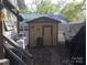 Exterior of home with shed, trailer and lush trees at 108 Captains Ct # B116, Mount Gilead, NC 27306