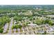 An aerial view of a neighborhood with mature trees and well-maintained homes at 1144 Spicewood Pines Rd at 1144 Spicewood Pines Rd, Fort Mill, SC 29708
