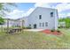 View of the backyard showing a patio, swing set, manicured lawn, and attractive landscaping at 1144 Spicewood Pines Rd, Fort Mill, SC 29708