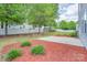 Wide backyard featuring a patio, a swing set, lush grass and wood-chipped areas at 1144 Spicewood Pines Rd, Fort Mill, SC 29708