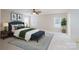 Spacious main bedroom features neutral colors, a large bed, bench and stylish decor at 1144 Spicewood Pines Rd, Fort Mill, SC 29708