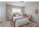 Charming bedroom featuring stylish decor, including art, plants, and a comfortable bed setup, making it a relaxing retreat at 1144 Spicewood Pines Rd, Fort Mill, SC 29708