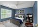 Nicely decorated bedroom featuring a cozy bed, a ceiling fan, and a window offering a bright and welcoming space at 1144 Spicewood Pines Rd, Fort Mill, SC 29708