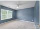 Cozy bedroom features neutral carpet, and a ceiling fan at 1144 Spicewood Pines Rd, Fort Mill, SC 29708