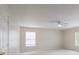 Bright bedroom features neutral carpet, white walls and a ceiling fan at 1144 Spicewood Pines Rd, Fort Mill, SC 29708