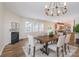 Dining area with modern chandelier and open access to the kitchen with stainless steel appliances at 1144 Spicewood Pines Rd, Fort Mill, SC 29708
