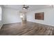 Bright and open living room space with hardwood floors, a mounted entertainment center, and a ceiling fan at 1144 Spicewood Pines Rd, Fort Mill, SC 29708