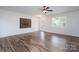 Large living room boasting hardwood floors, a ceiling fan, and a mounted entertainment center at 1144 Spicewood Pines Rd, Fort Mill, SC 29708