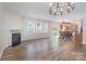 Open living space with fireplace, hardwood floors, and seamless connection to the kitchen and dining areas at 1144 Spicewood Pines Rd, Fort Mill, SC 29708