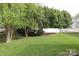 Spacious back yard featuring a bench, a wooden fence, and a privacy fence at 11623 Black Maple Ave, Charlotte, NC 28269