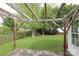 Backyard with wood patio covering and bench at 11623 Black Maple Ave, Charlotte, NC 28269