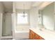 Relaxing bathroom with dual sink vanity, soaking tub, glass shower, and modern fixtures at 11623 Black Maple Ave, Charlotte, NC 28269