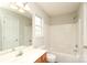 Bathroom with single sink vanity and tub with tiled surround at 11623 Black Maple Ave, Charlotte, NC 28269