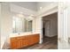 Bathroom with double sink vanity, a large mirror and wood look flooring at 11623 Black Maple Ave, Charlotte, NC 28269