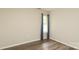 Bedroom with neutral walls, light wood look flooring and window at 11623 Black Maple Ave, Charlotte, NC 28269