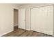 Bedroom with neutral walls, light wood look flooring and closet at 11623 Black Maple Ave, Charlotte, NC 28269