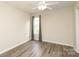 Bedroom with neutral walls, ceiling fan, and window at 11623 Black Maple Ave, Charlotte, NC 28269