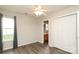 Bedroom with window, closet, ceiling fan and door to bathroom at 11623 Black Maple Ave, Charlotte, NC 28269