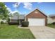 Charming single-story brick home featuring a well-manicured lawn and an attached two-car garage at 11623 Black Maple Ave, Charlotte, NC 28269