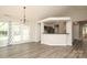 Bright, open-concept living area featuring a modern fireplace, vaulted ceilings, and easy access to the kitchen at 11623 Black Maple Ave, Charlotte, NC 28269