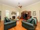 Cozy living room with fireplace, hardwood floors, and abundant seating at 11778 Crossroads Pl, Concord, NC 28025