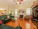 Inviting living room featuring a fireplace and seamlessly flowing into the kitchen at 11778 Crossroads Pl, Concord, NC 28025