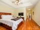 Spacious main bedroom with hardwood floors and access to an ensuite bathroom at 11778 Crossroads Pl, Concord, NC 28025