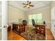 Home office features high ceilings, a ceiling fan, a large window, and two work stations at 11778 Crossroads Pl, Concord, NC 28025