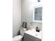 Bathroom features a toilet, a modern faucet, and a shower in the mirror's reflection at 11817 Five Cedars Rd, Charlotte, NC 28226