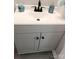 Bathroom vanity with a cabinet and a modern faucet at 11817 Five Cedars Rd, Charlotte, NC 28226