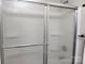 New shower boasts a modern glass door at 11817 Five Cedars Rd, Charlotte, NC 28226