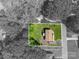 Aerial view of home highlighting yard with fire pit and landscaping at 119 Meadowbrook Ln, Davidson, NC 28036